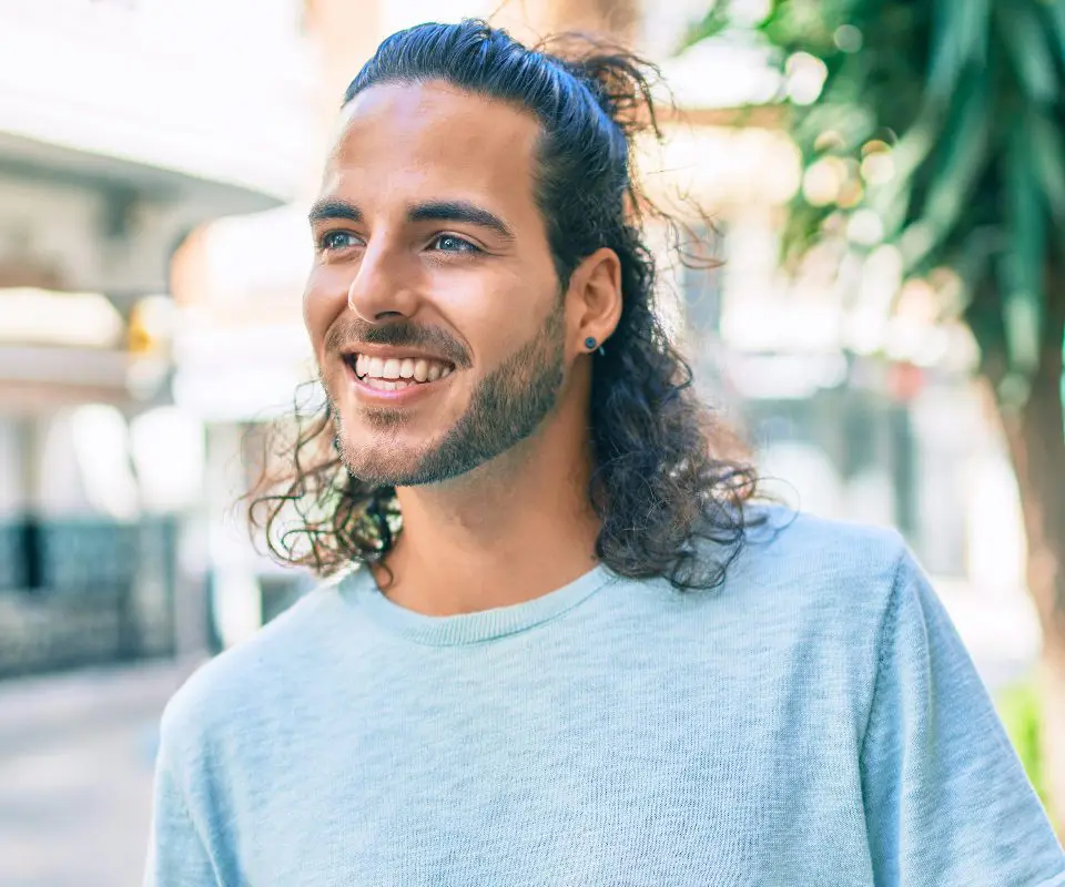 man smiling outdoors