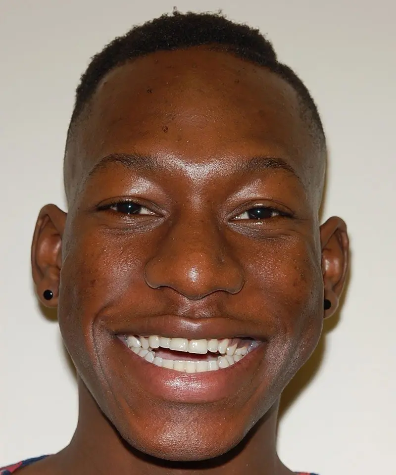 A black man smiling - Smilebliss