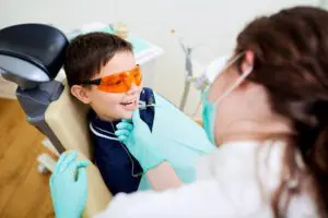 A child kid is boy at dentist in dental office. Dental treatme
