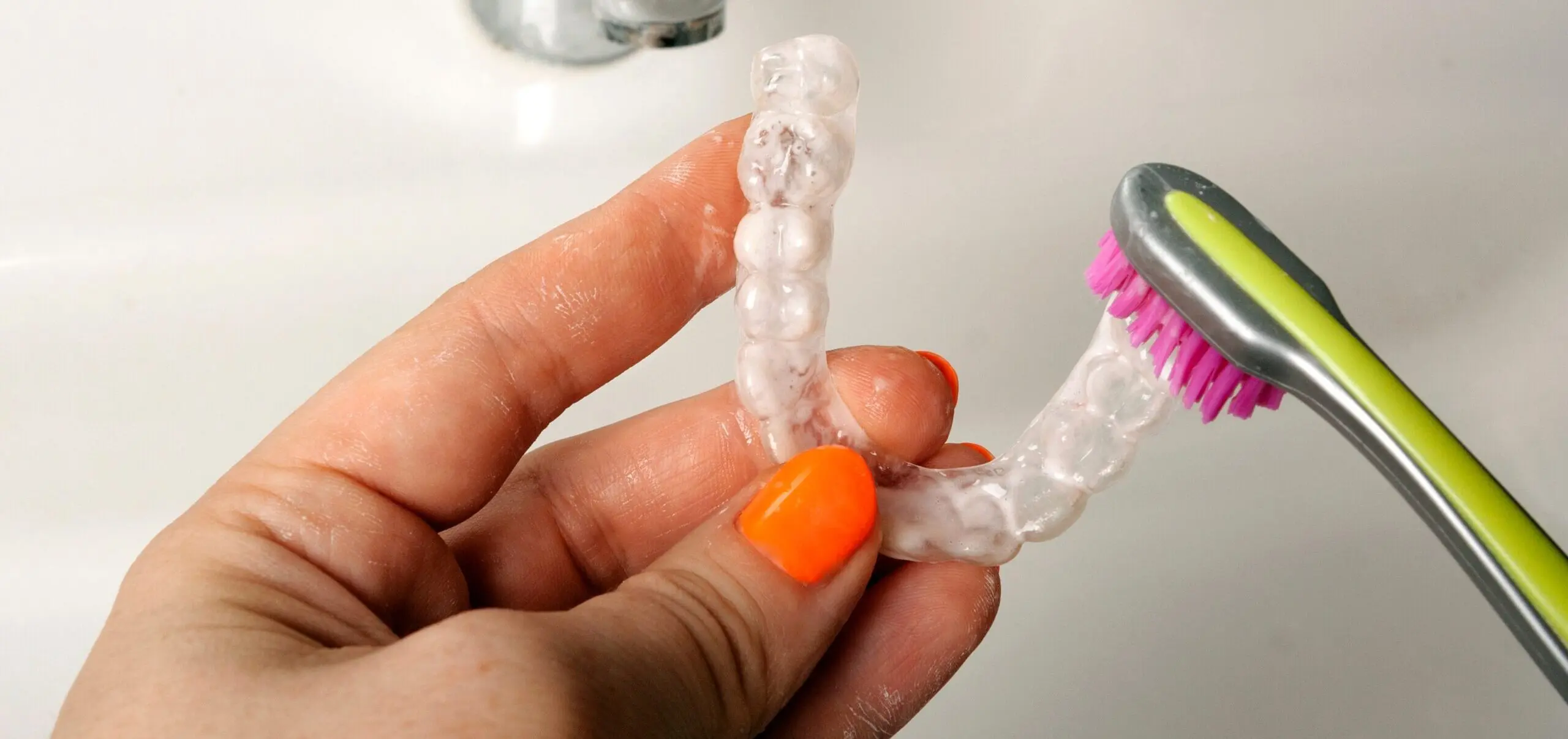 cleaning-of-retention-mouth-guards-with-toothbrush-2023-11-27-05-29-52-utc