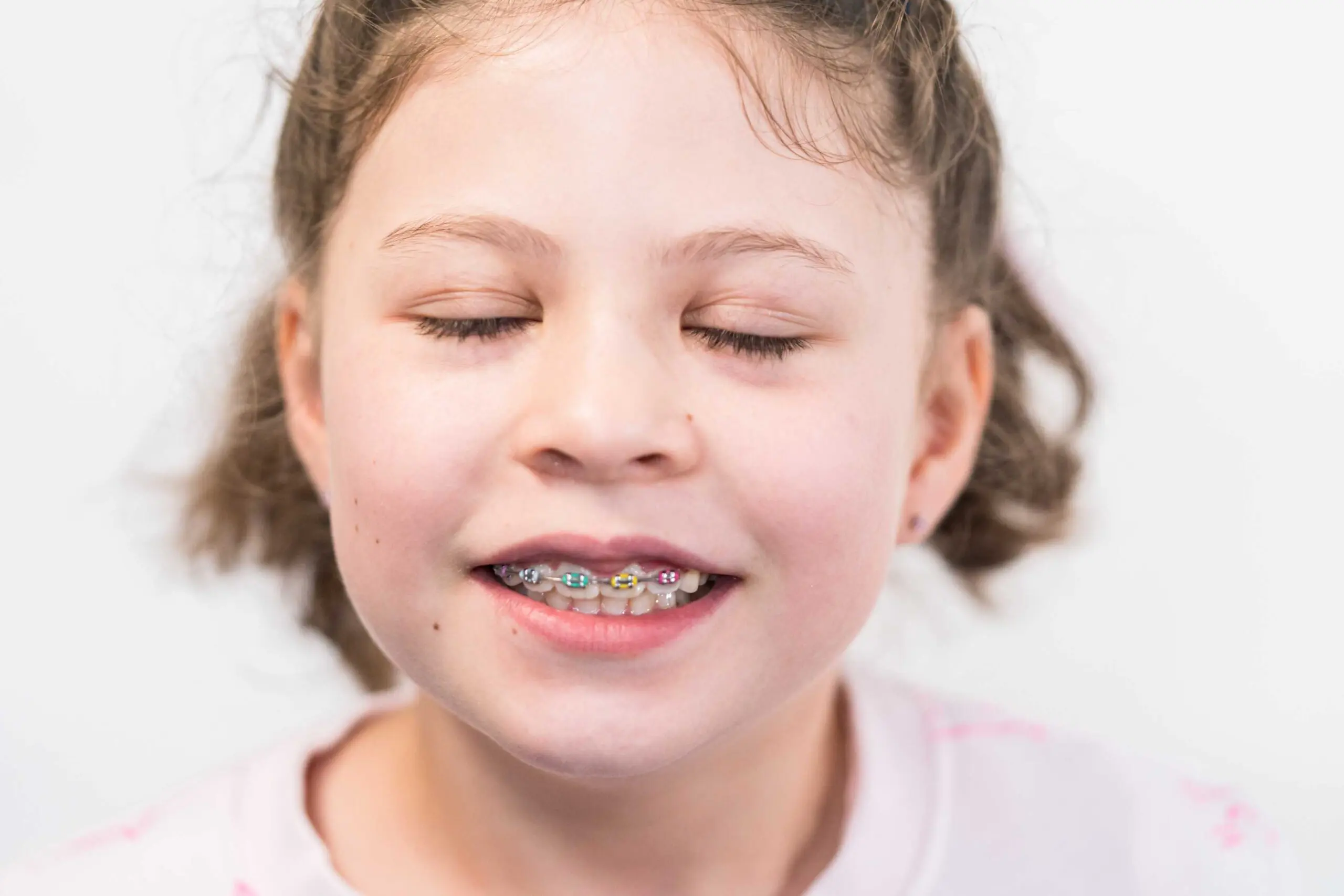 young girl with braces