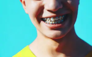 Portrait of a unrecognizable young man with brackets
