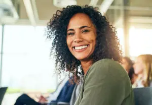 Cropped portrait of an attractive young businesswoman sitting in a conference room during a seminar.
