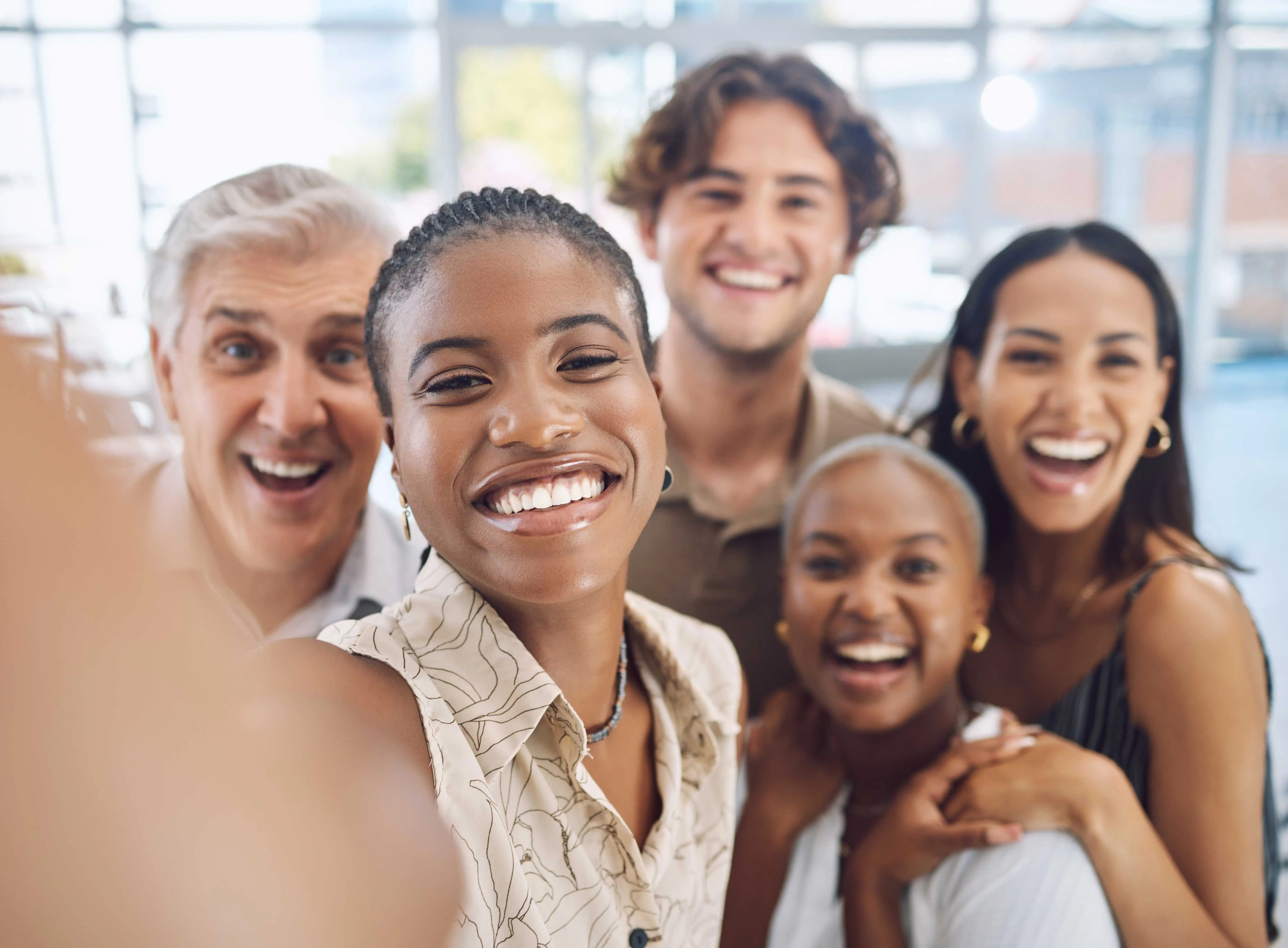 group of workmates smiling at camera