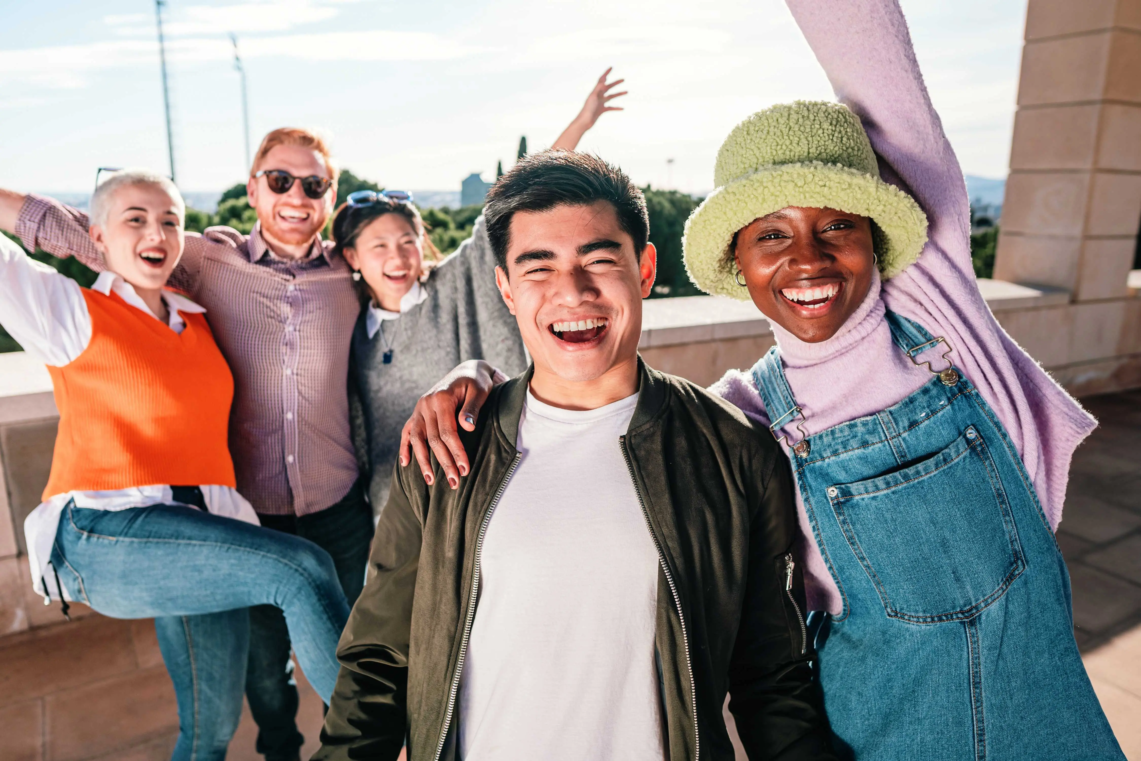 group of friends smiling in front of camera