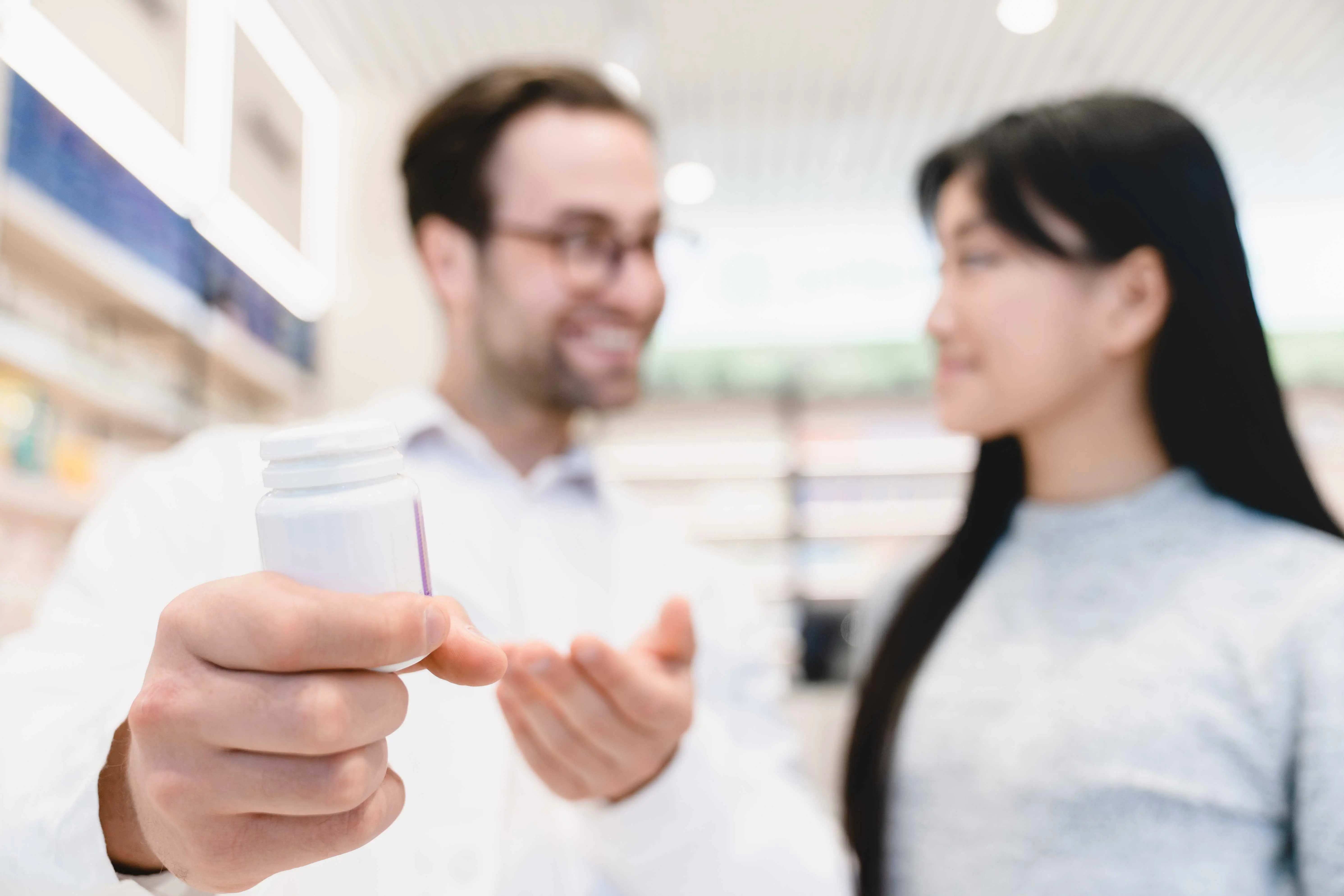 woman buying pain reliever