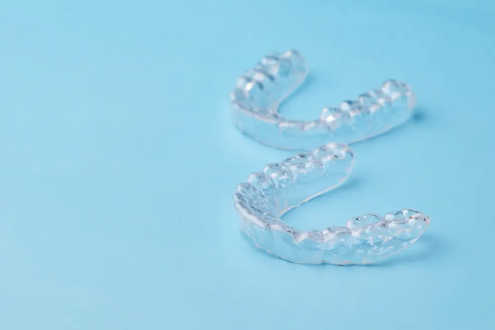 Removable teeth aligners on the blue background