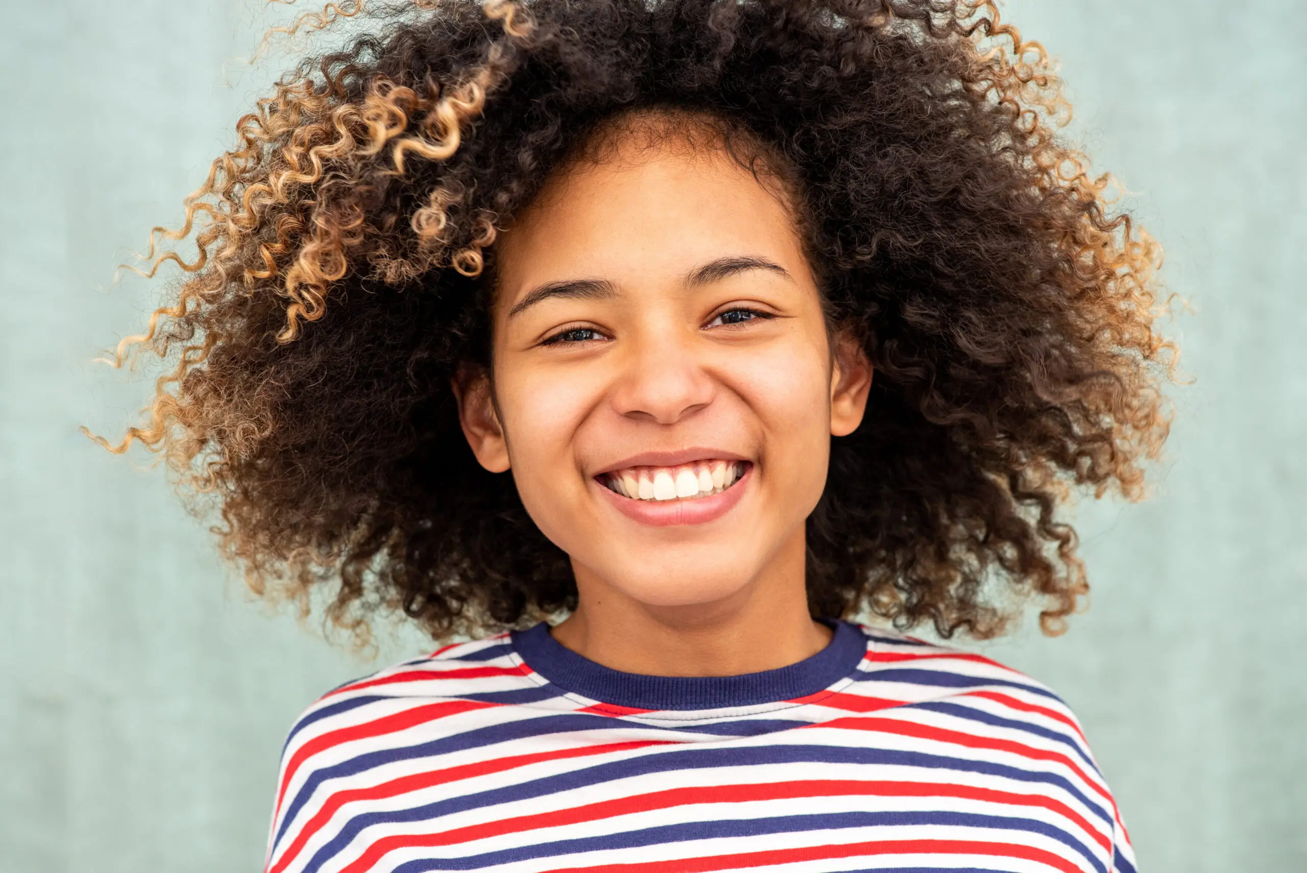 Smiling girl showing perfect teeth.