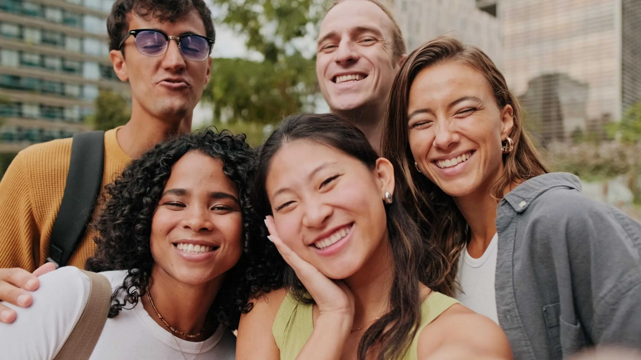happy group of friends taking a photo