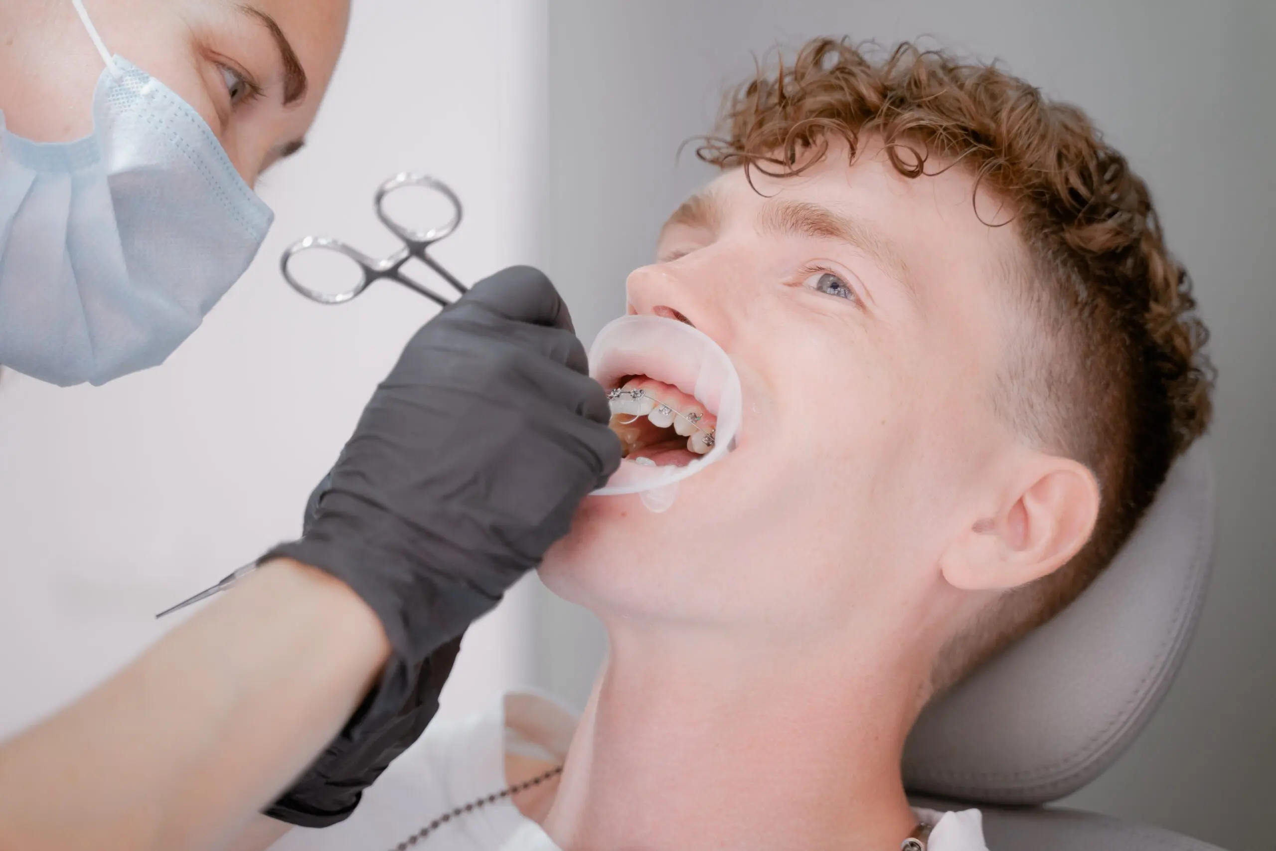 adult-man-receives-orthodontic-treatment-at-dental-2026-03-24-07-51-52-utc