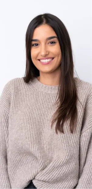 woman in sweater smiling