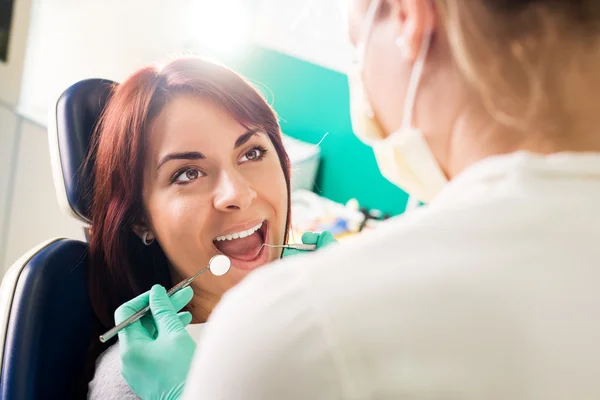 a woman in a dental checkup