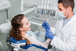 Dentist Checking Patients Braces