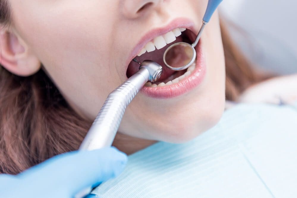 Dentist curing patients teeth