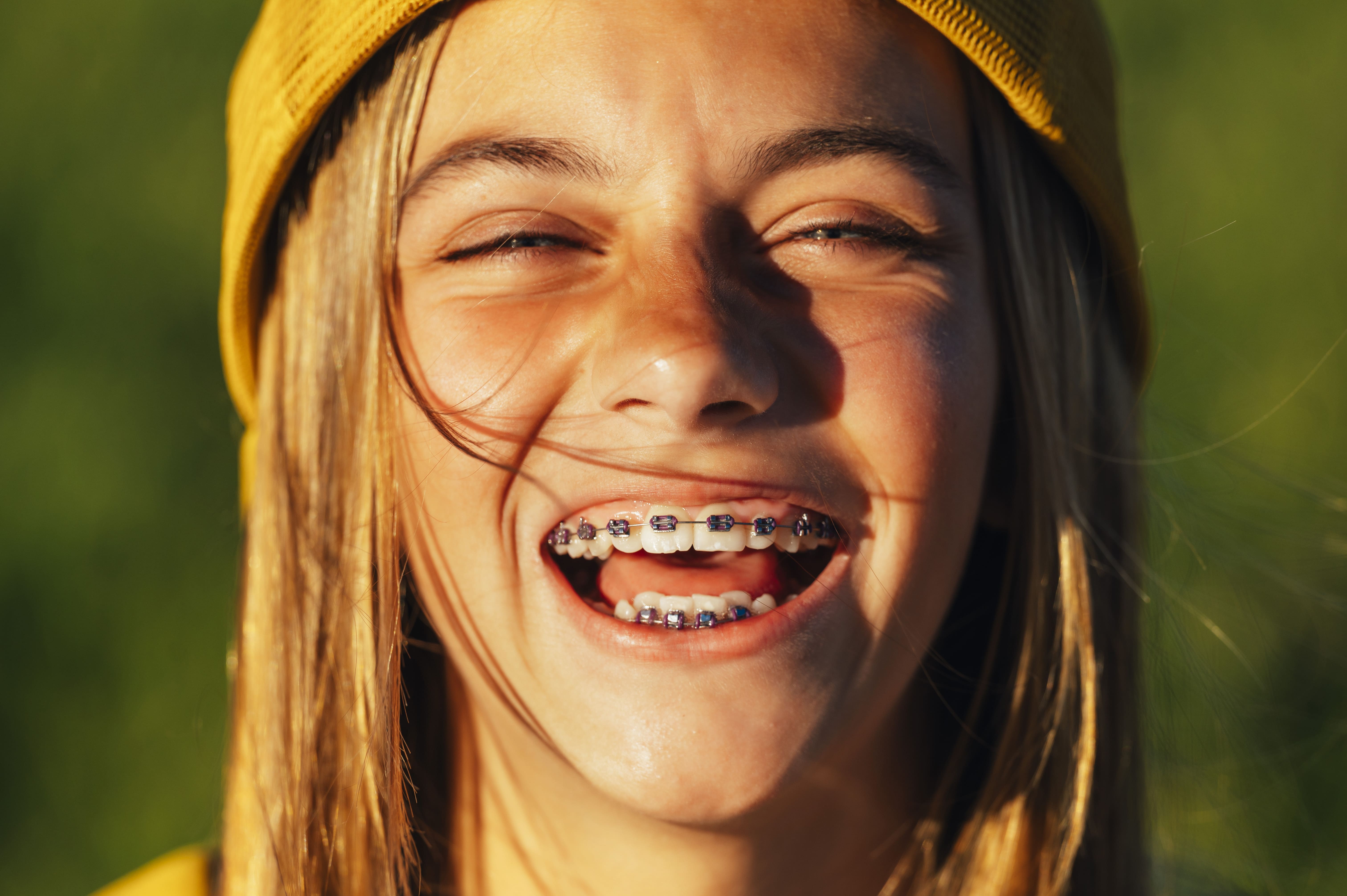 portrait of blonde girl with braces