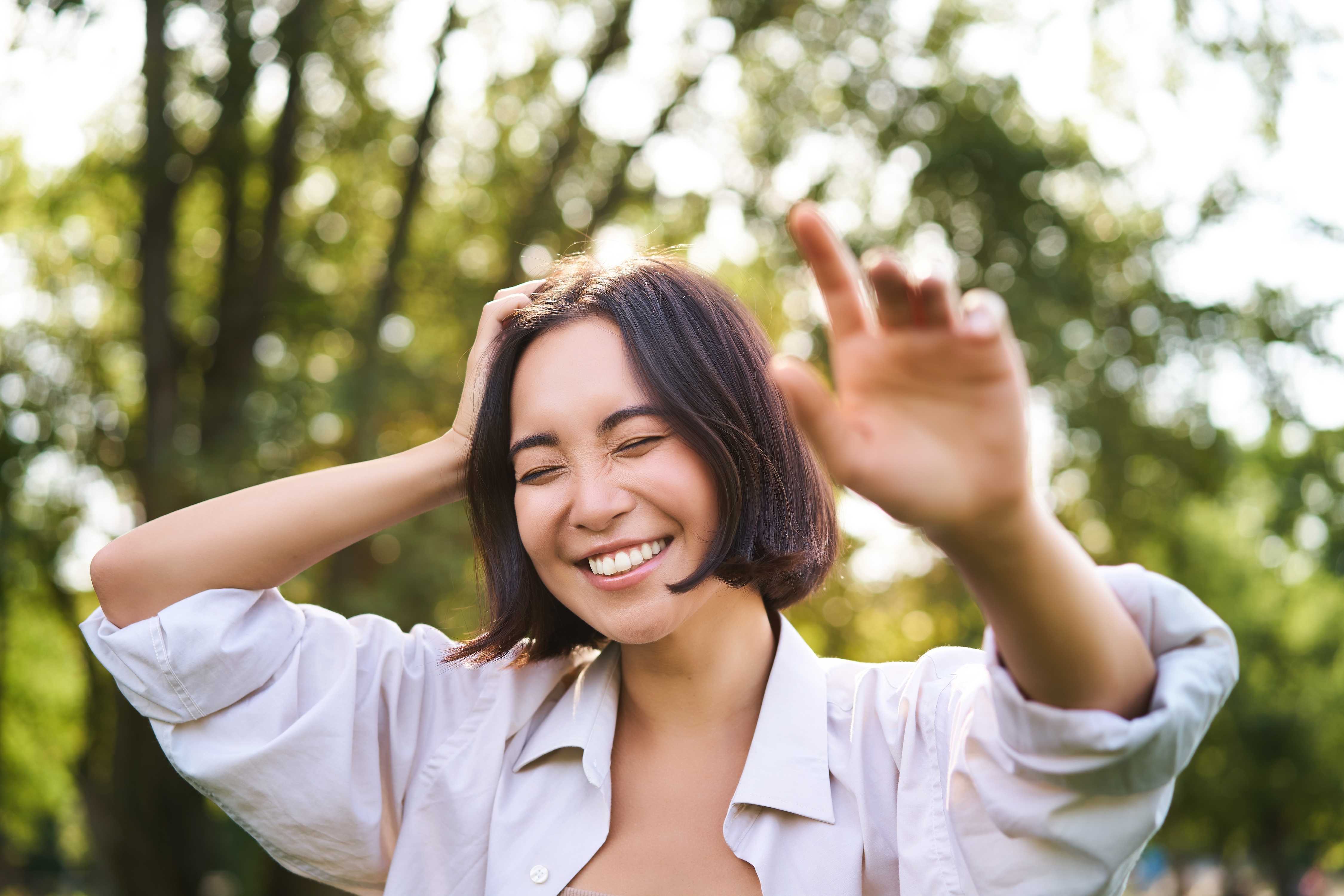 asian woman smiling at camera