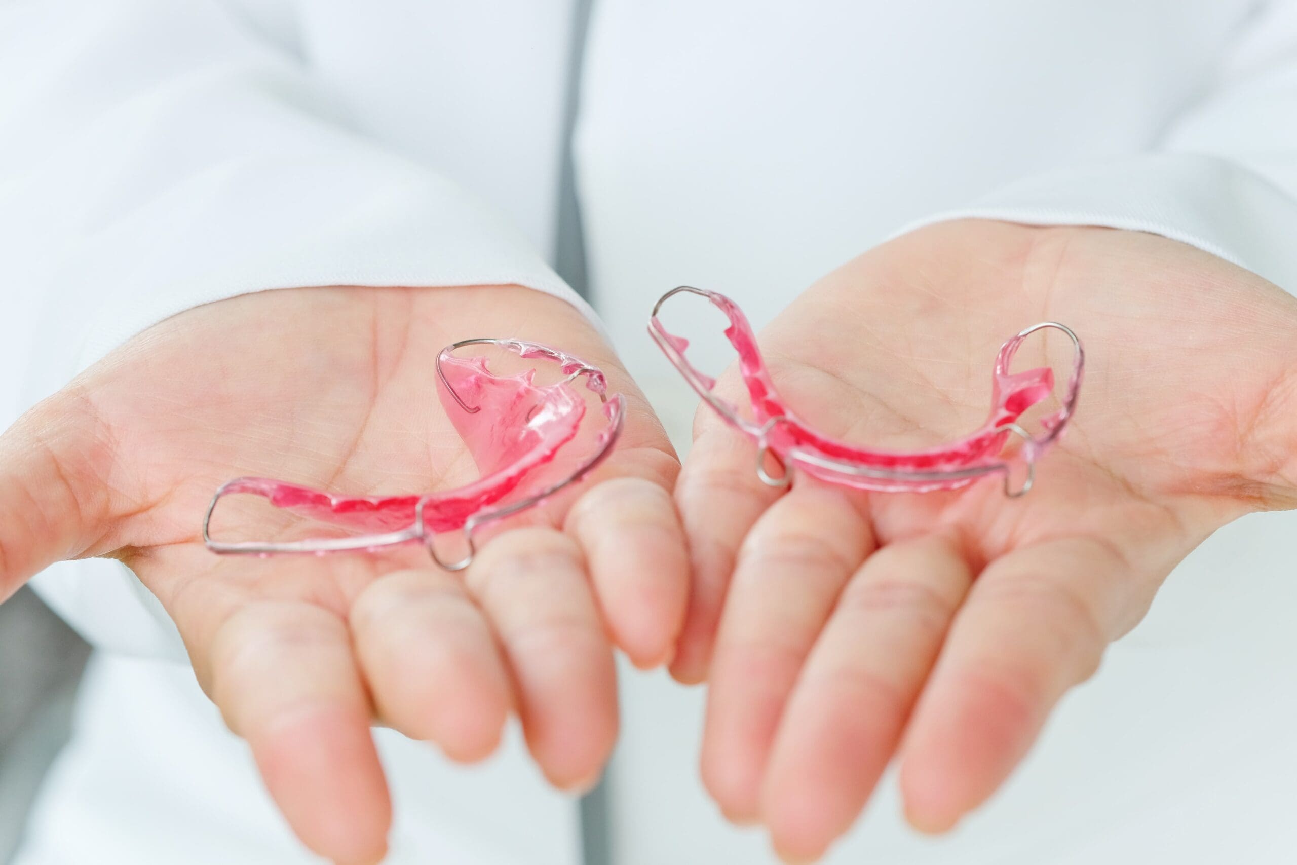 dentist-holding-retainer-2025-03-10-16-09-03-utc-min