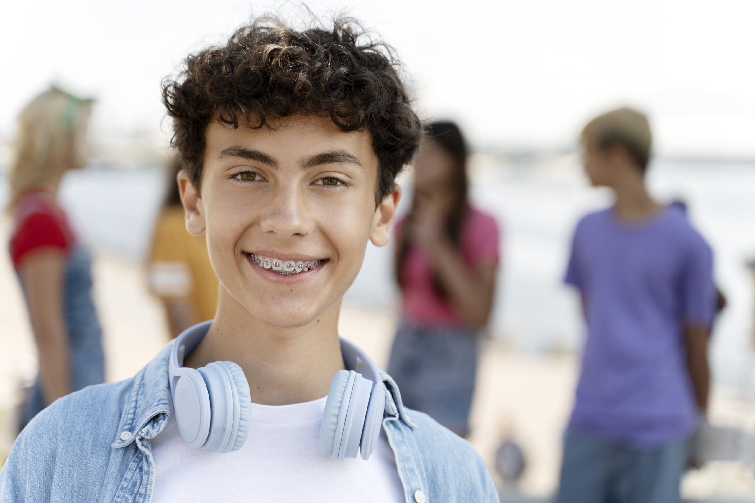 portrait-of-smiling-teenager-with-braces-wearing-h-2025-02-20-09-36-47-utc-min